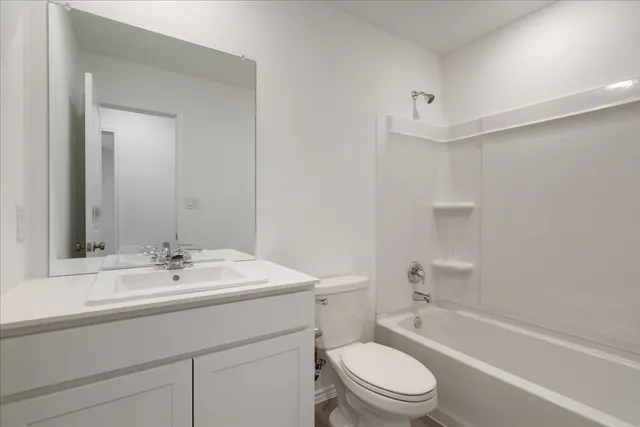 a bathroom with a sink a toilet and a bathtub