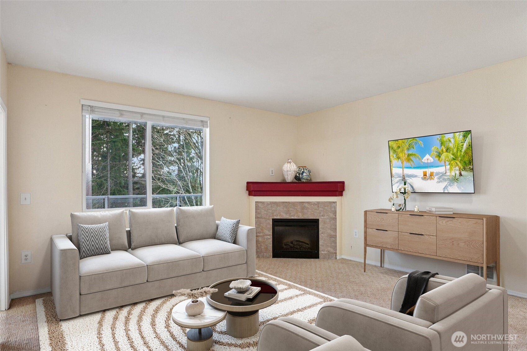a living room with furniture a window and a fireplace