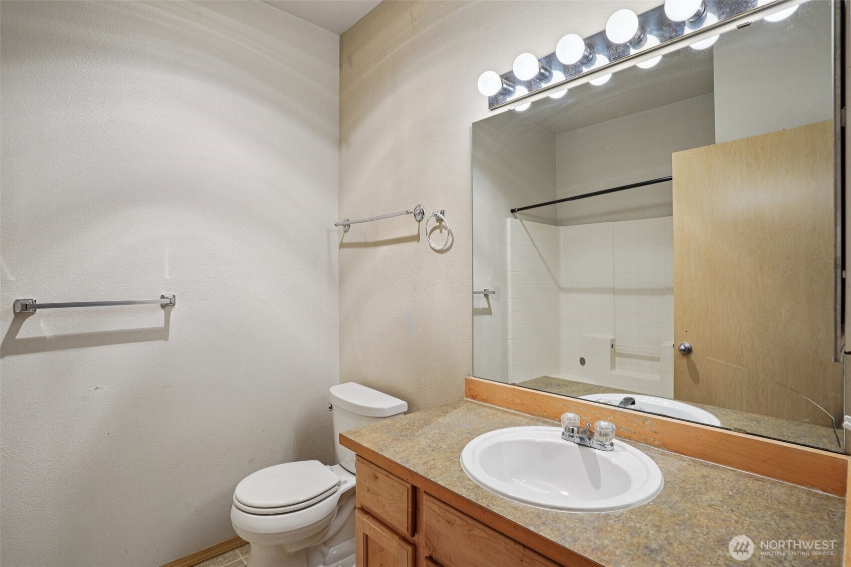 2800 Southeast 8th Street, Unit 2132 Renton, WA 98058 - Photo 13 of 24 a bathroom with a sink toilet and a mirror