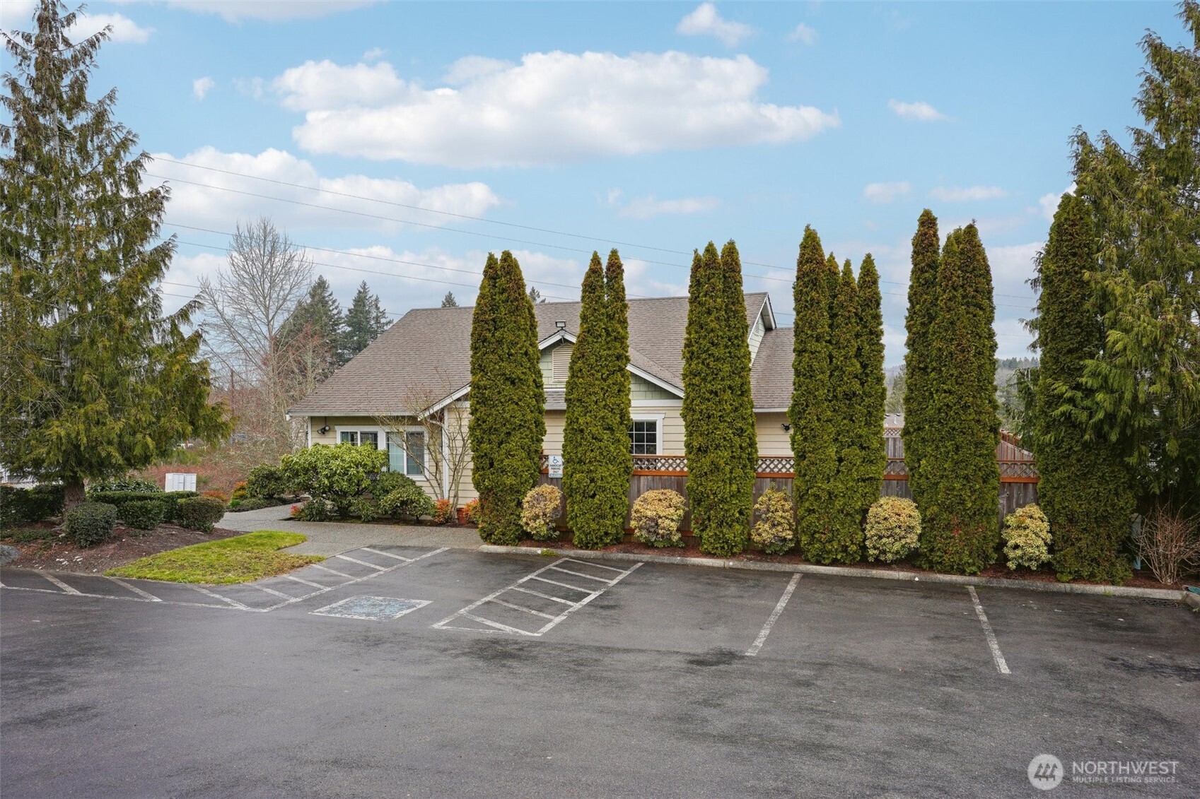 2800 Southeast 8th Street, Unit 2132 Renton, WA 98058 - Photo 19 of 24 a view of a city street lined with large trees
