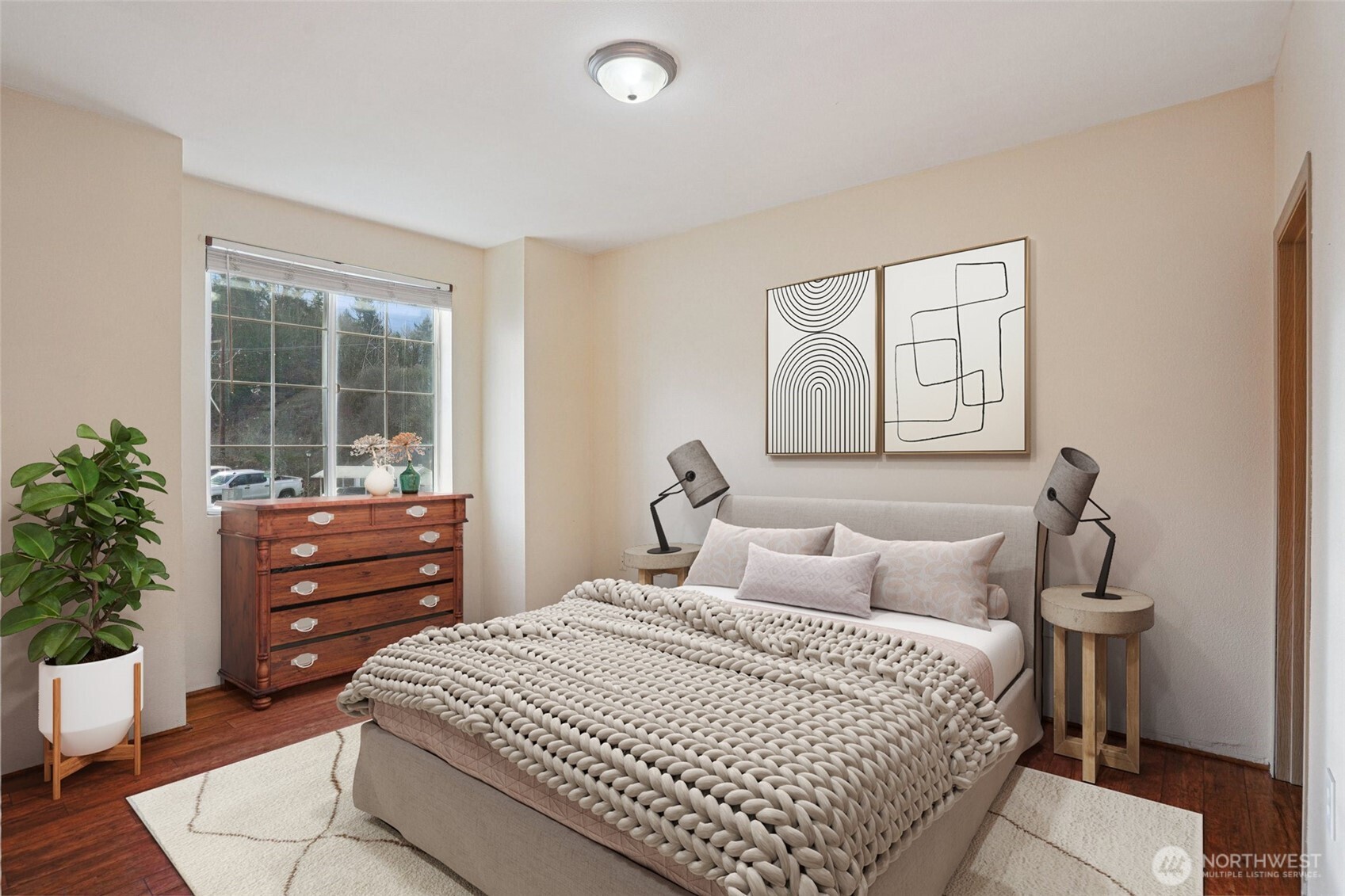 2800 Southeast 8th Street, Unit 2132 Renton, WA 98058 - Photo 8 of 24 a bedroom with a bed and a potted plant