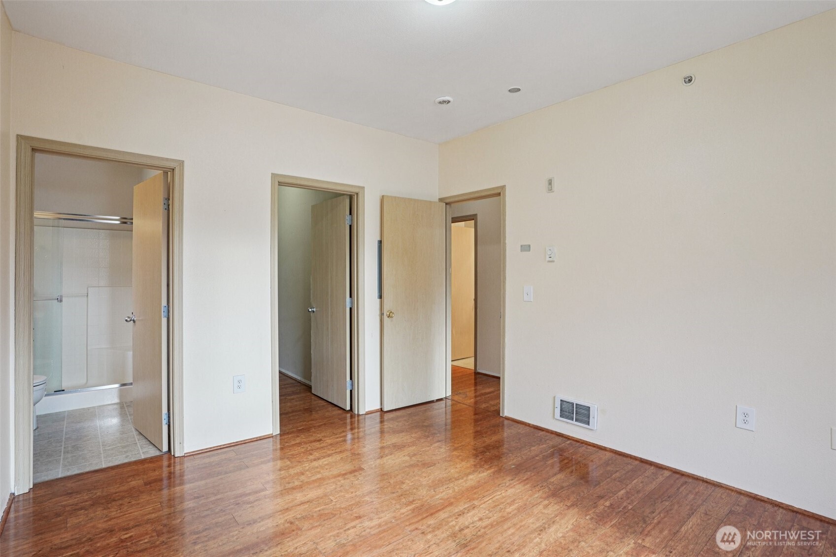2800 Southeast 8th Street, Unit 2132 Renton, WA 98058 - Photo 9 of 24 a view of an empty room with wooden floor and closet