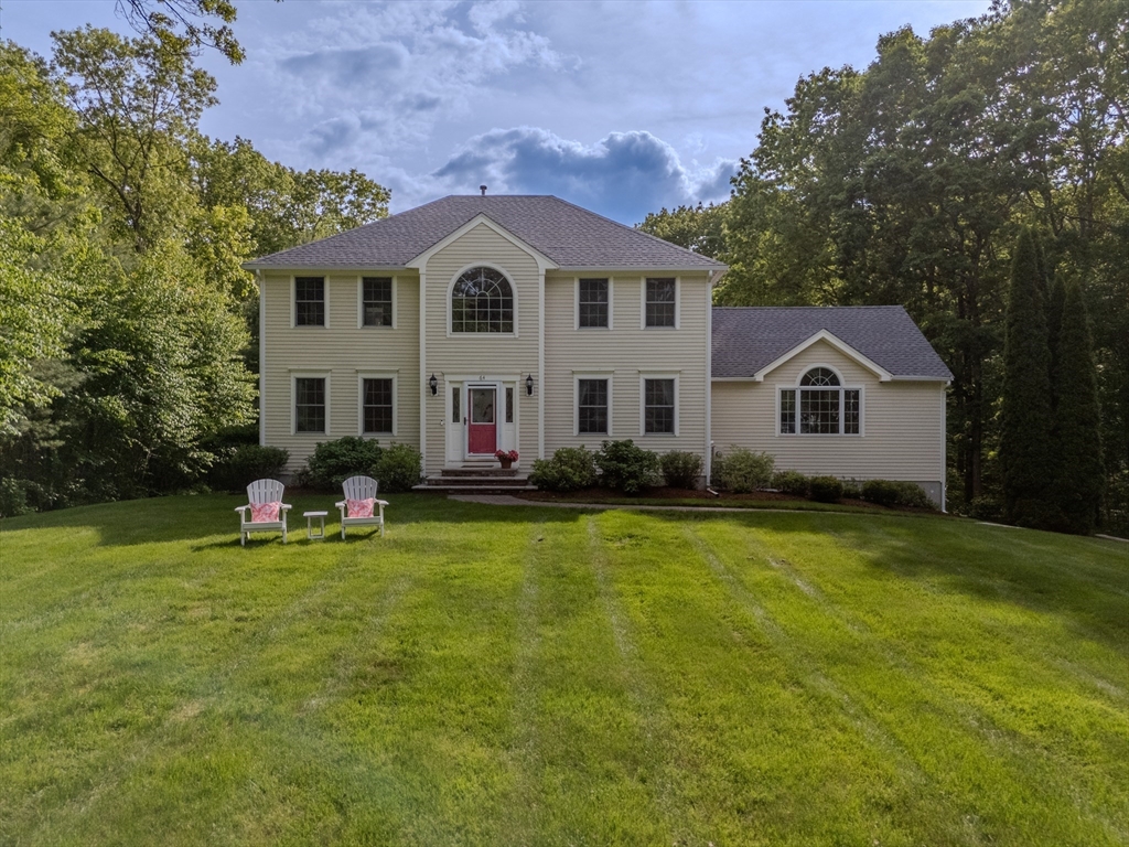 64 Jacques Road Tyngsboro, MA 01879 - Photo 1 of 39 a front view of a house with a yard