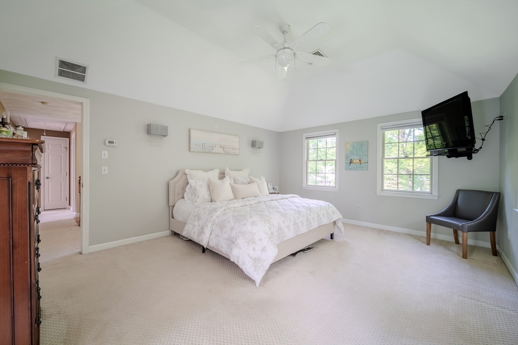 64 Jacques Road Tyngsboro, MA 01879 - Photo 17 of 39 a spacious bedroom with a bed and a flat screen tv