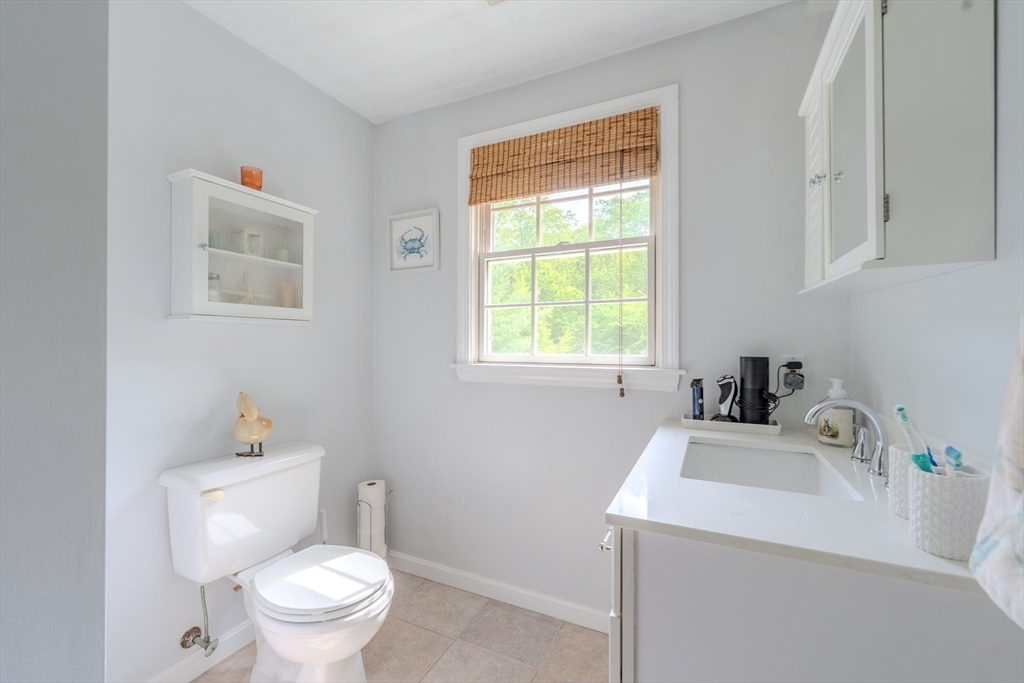 64 Jacques Road Tyngsboro, MA 01879 - Photo 27 of 39 a bathroom with a sink a toilet and a window