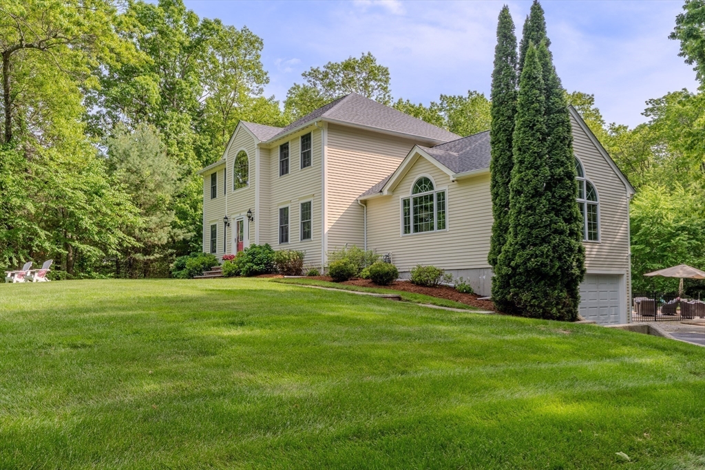 64 Jacques Road Tyngsboro, MA 01879 - Photo 35 of 39 a front view of a house with a yard