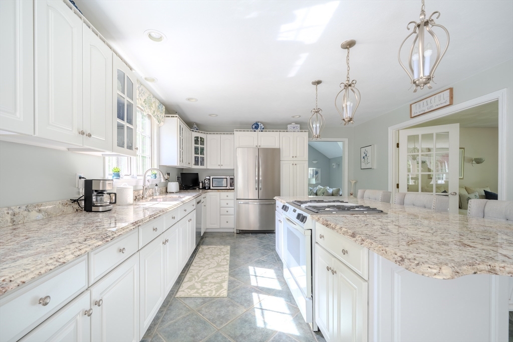 64 Jacques Road Tyngsboro, MA 01879 - Photo 6 of 39 a kitchen with sink stove and refrigerator