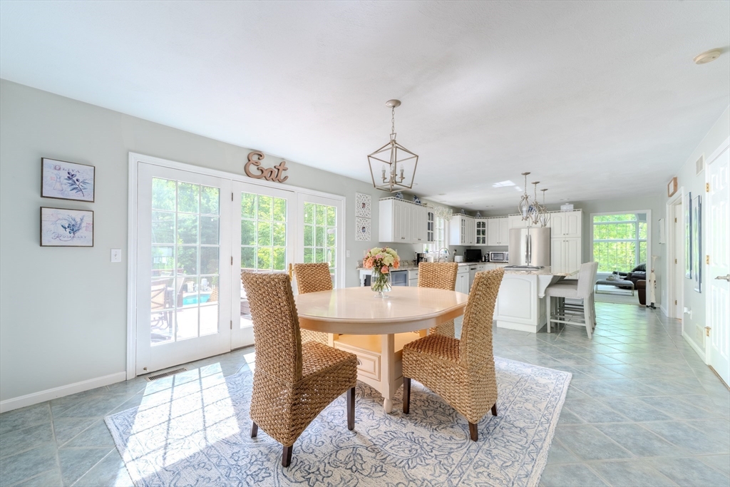 64 Jacques Road Tyngsboro, MA 01879 - Photo 7 of 39 a view of a dining room with furniture window and outside view