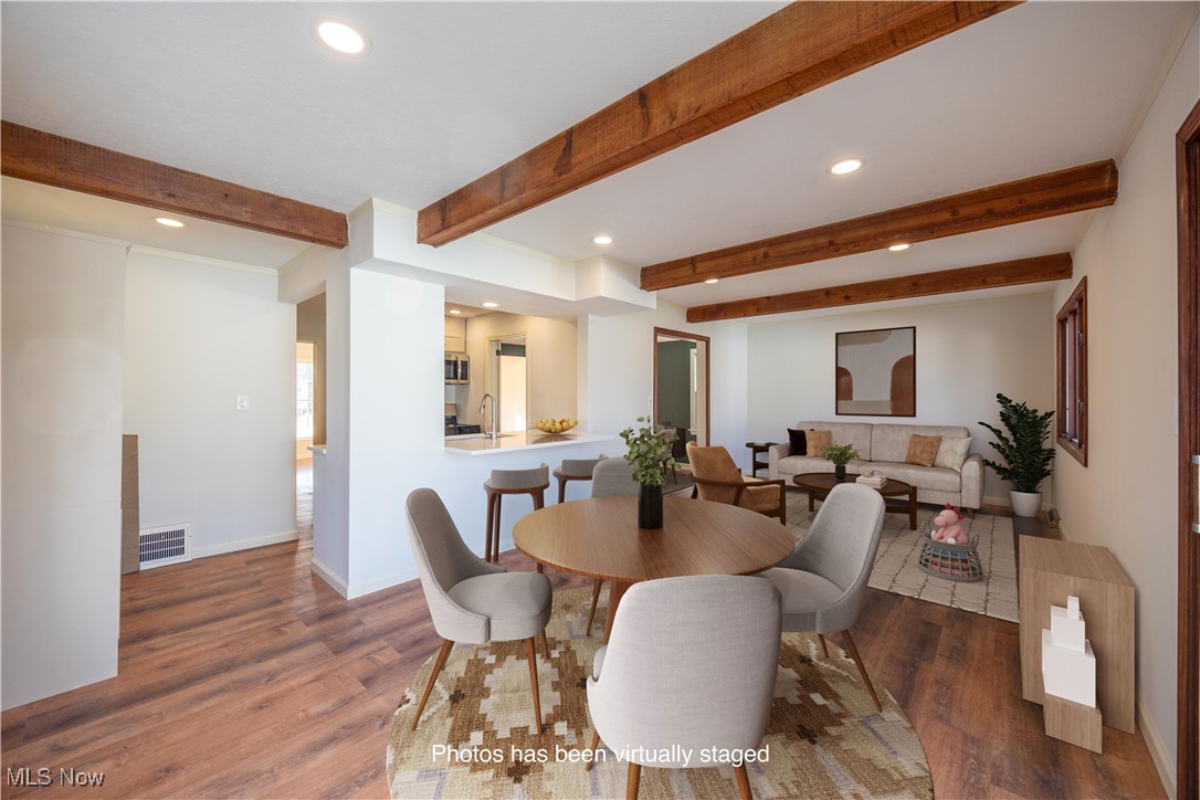 3797 Northwood Road Cleveland, OH 44118 - Photo 15 of 49 Dining room featuring recessed lighting, beam ceiling, and dark wood finished floors