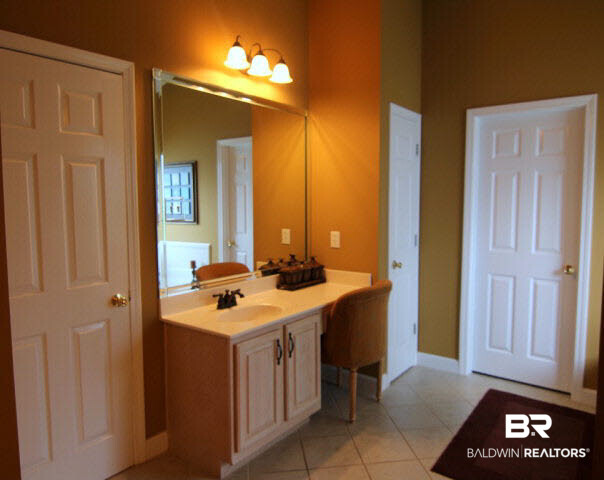 7263 Highpointe Place East Daphne, AL 36527 - Photo 17 of 22 This Master Bath features a separate shower and tub as well as his and hers vanities (hers has a makeup area)!