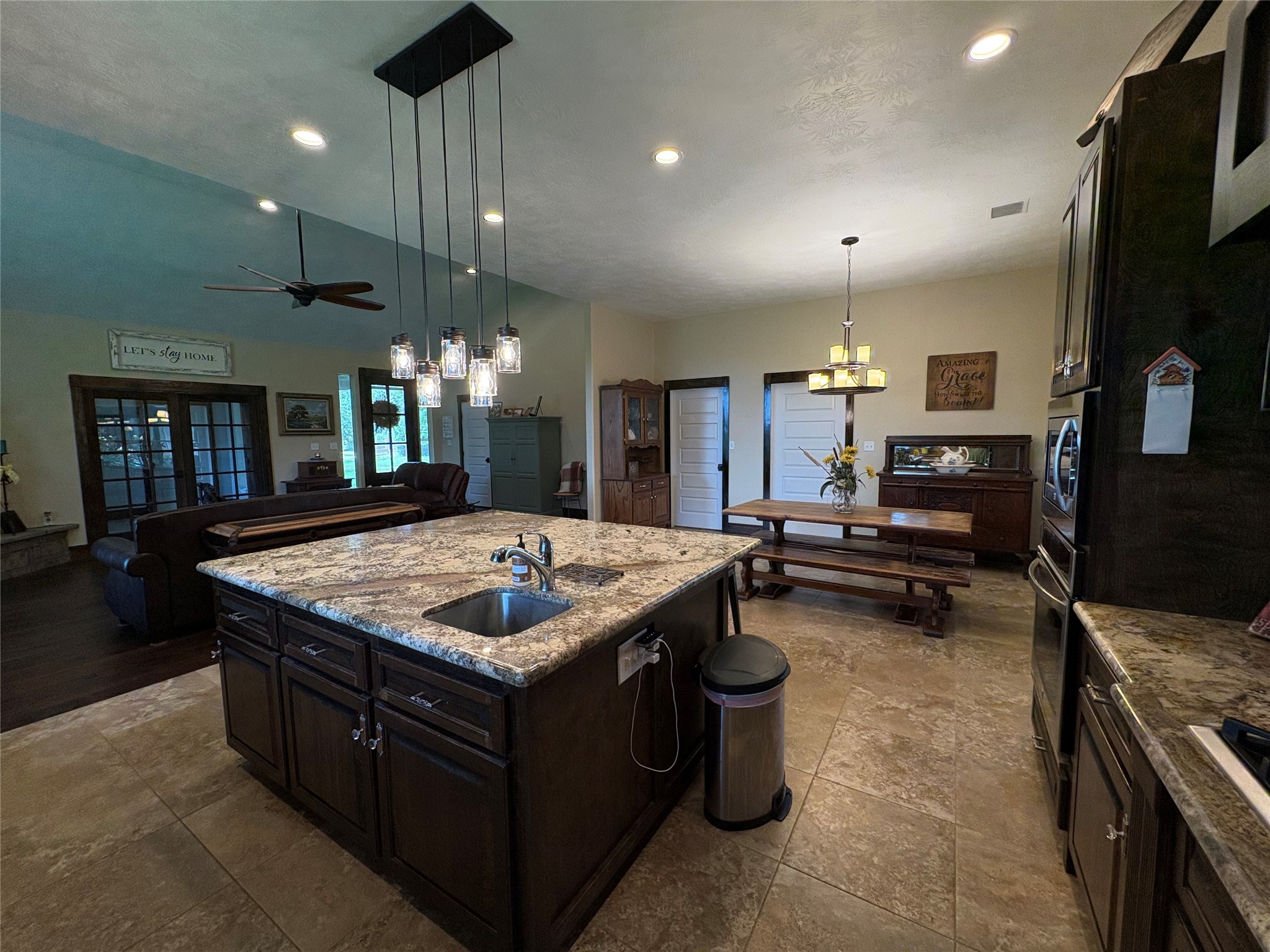 8595 Jared Road Bellville, TX 77418 - Photo 12 of 30 a kitchen with a stove a counter space and a sink