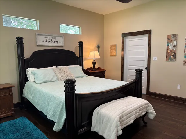 a bedroom with bed and a window