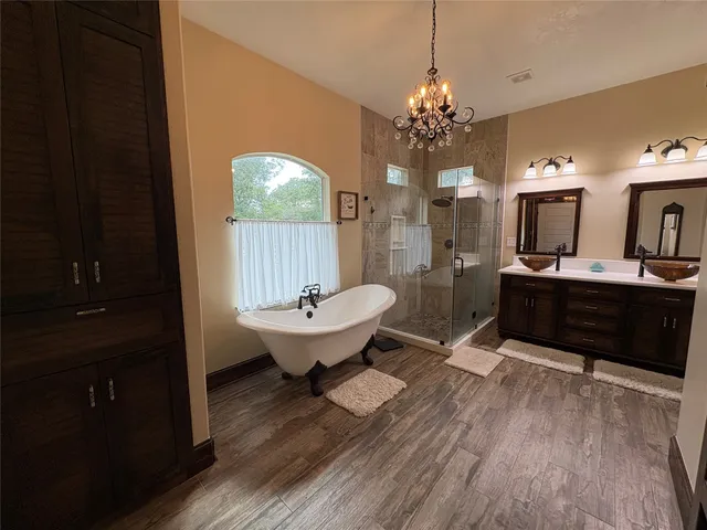 a spacious bathroom with a sink shower and mirror