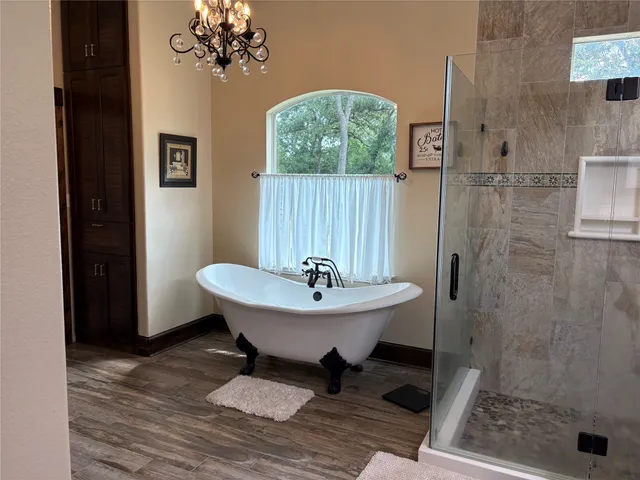 a bathroom with a sink mirror and a shower
