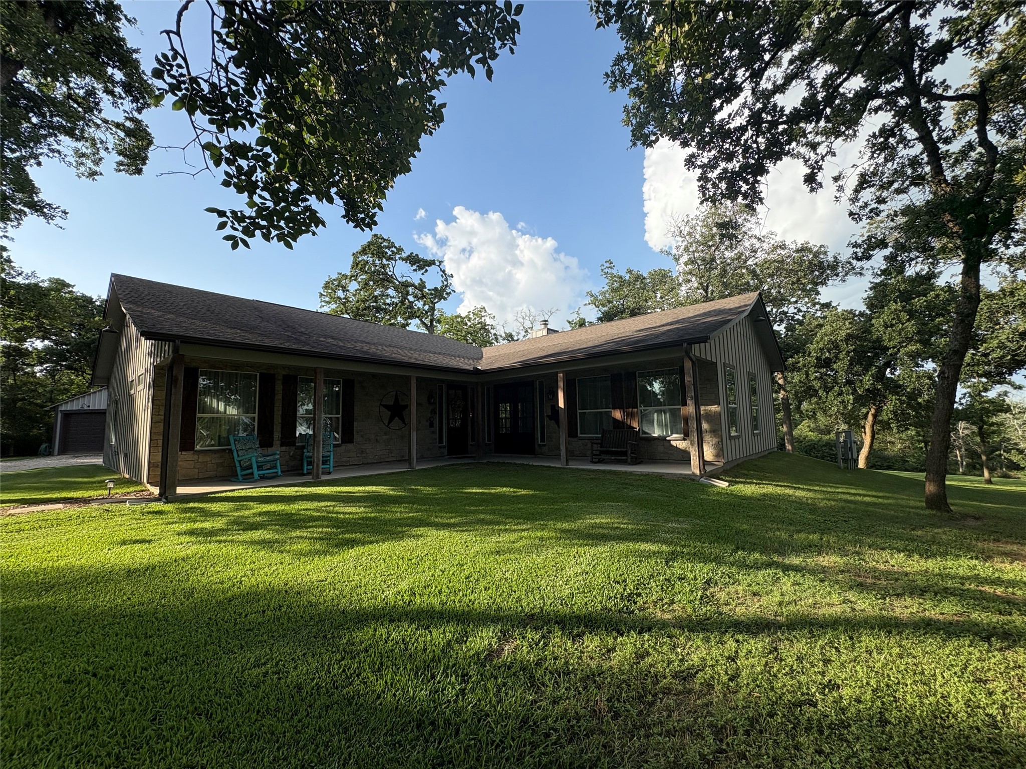 8595 Jared Road Bellville, TX 77418 - Photo 30 of 30 a front view of house with yard outdoor seating and green space