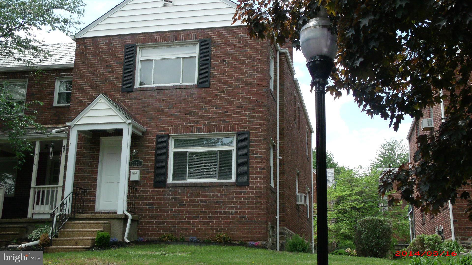 3712 Kimble Road Baltimore, MD 21218 - Photo 1 of 30 a front view of a house with a garden