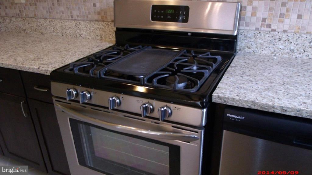 3712 Kimble Road Baltimore, MD 21218 - Photo 12 of 30 a close up of a stove top oven