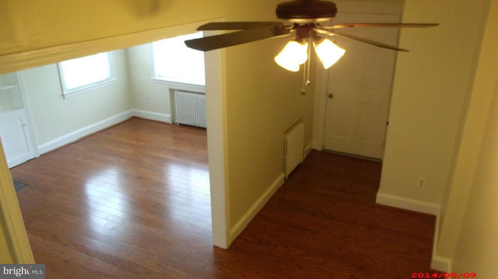 3712 Kimble Road Baltimore, MD 21218 - Photo 19 of 30 a view of a hallway with wooden floor