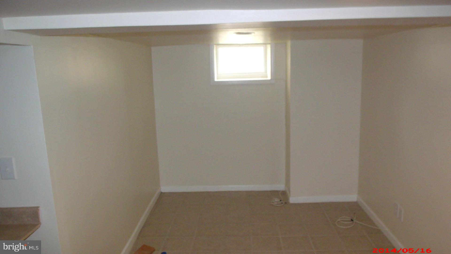 3712 Kimble Road Baltimore, MD 21218 - Photo 20 of 30 a view of an empty room with a window