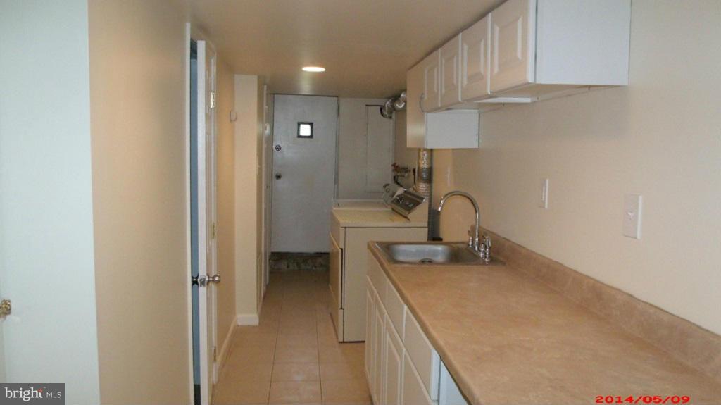 3712 Kimble Road Baltimore, MD 21218 - Photo 23 of 30 a bathroom with a sink and a mirror