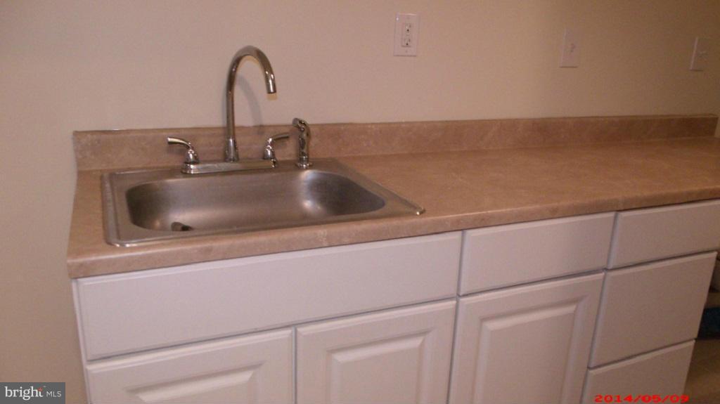 3712 Kimble Road Baltimore, MD 21218 - Photo 27 of 30 a close view of a sink and tap