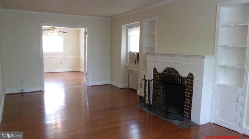 3712 Kimble Road Baltimore, MD 21218 - Photo 8 of 30 a view of empty room with wooden floor and closet
