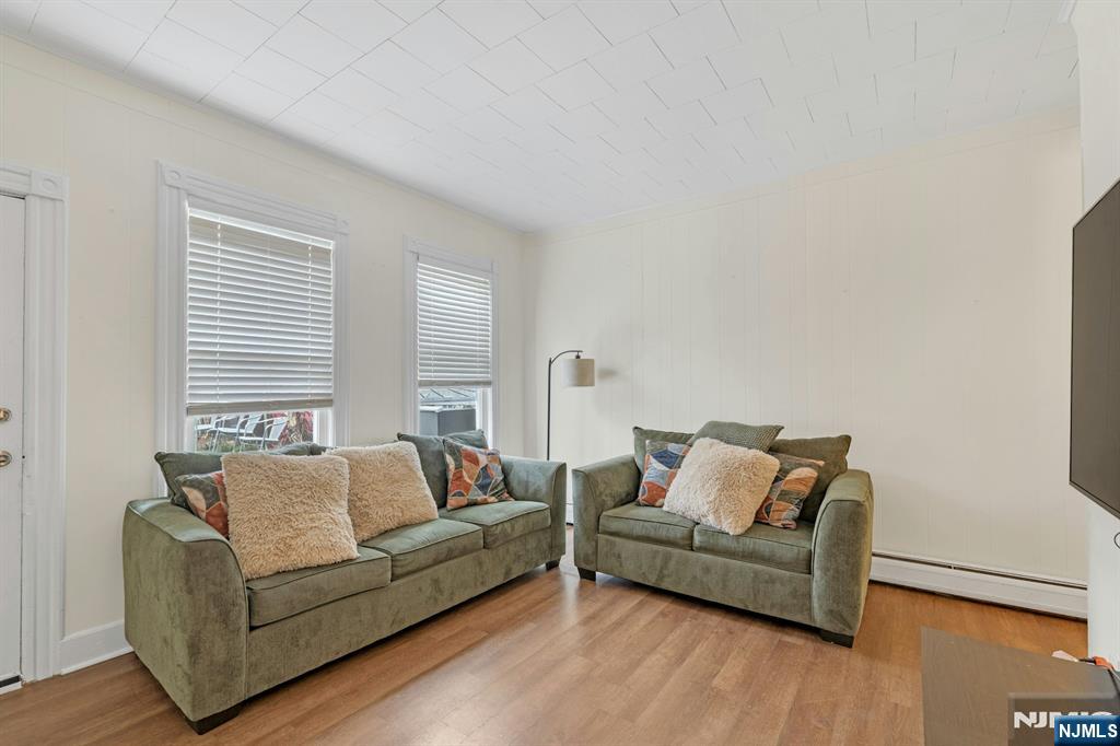 331 1/2 Forest Street Kearny, NJ 07032 - Photo 3 of 17 a living room with furniture and a couch