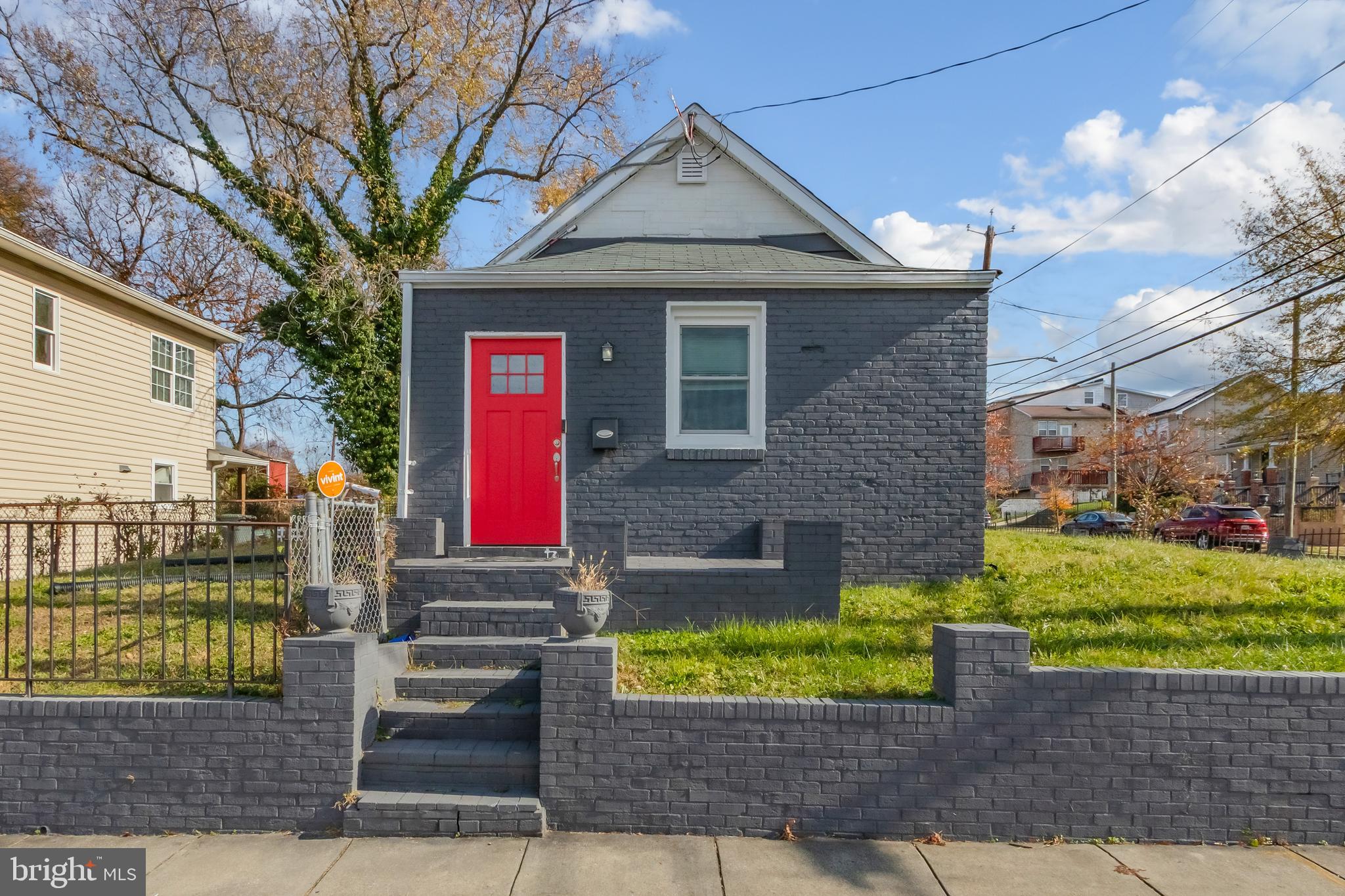 1101 51st Place Northeast Washington, DC 20019 - Photo 1 of 25 a front view of a house with garden