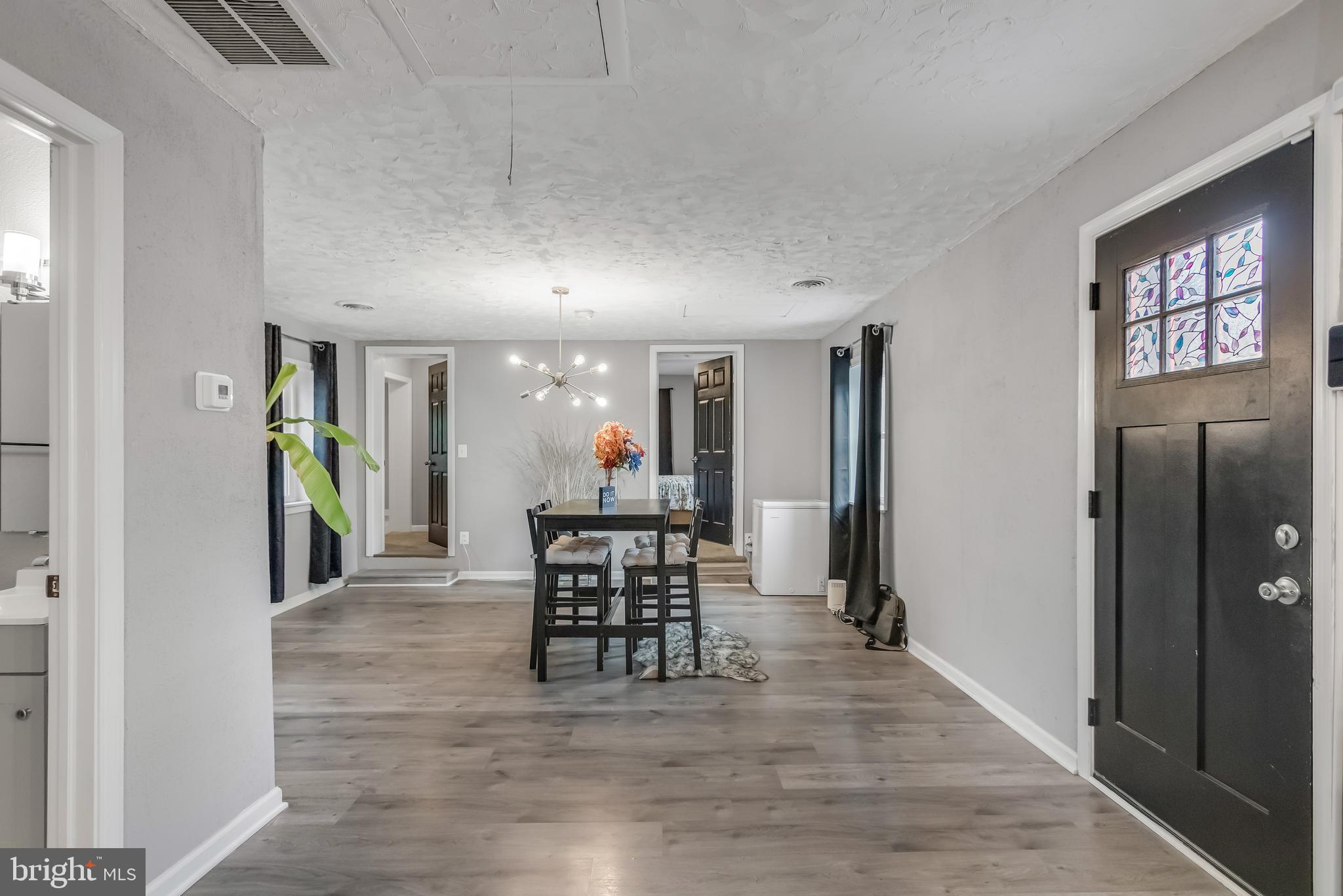 1101 51st Place Northeast Washington, DC 20019 - Photo 11 of 25 a view of a dining room with furniture window and wooden floor
