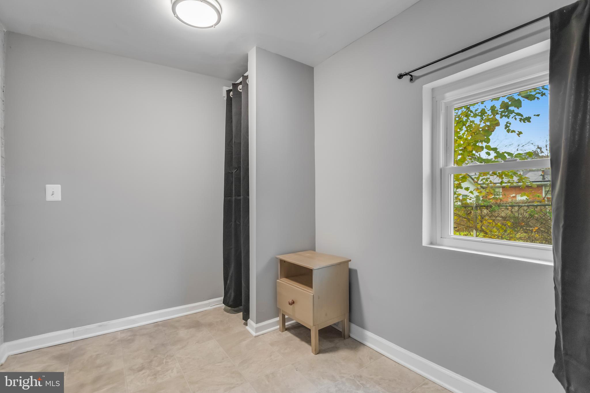 1101 51st Place Northeast Washington, DC 20019 - Photo 18 of 25 a view of an empty room with a window