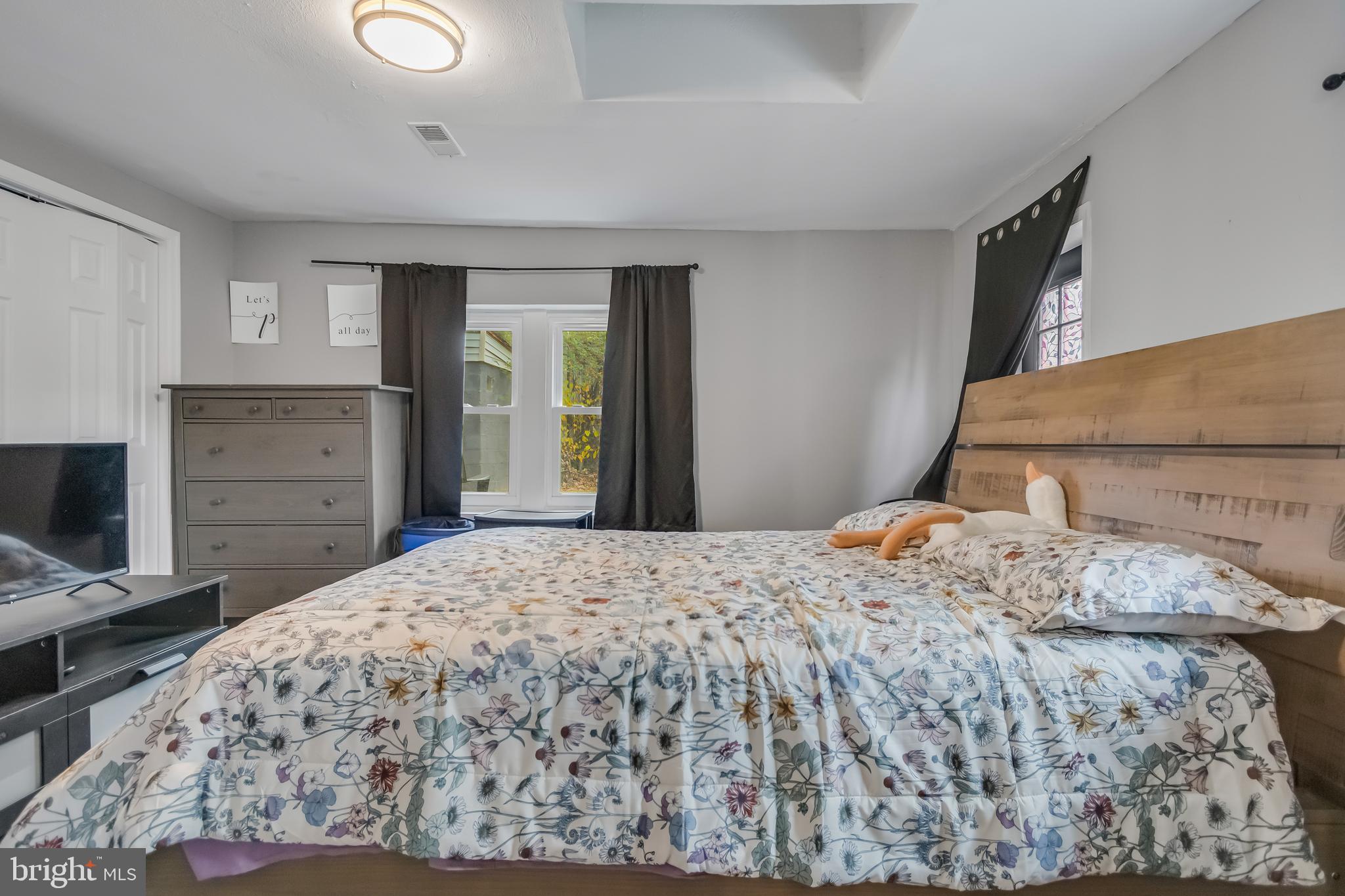 1101 51st Place Northeast Washington, DC 20019 - Photo 19 of 25 a bedroom with a bed and a dresser