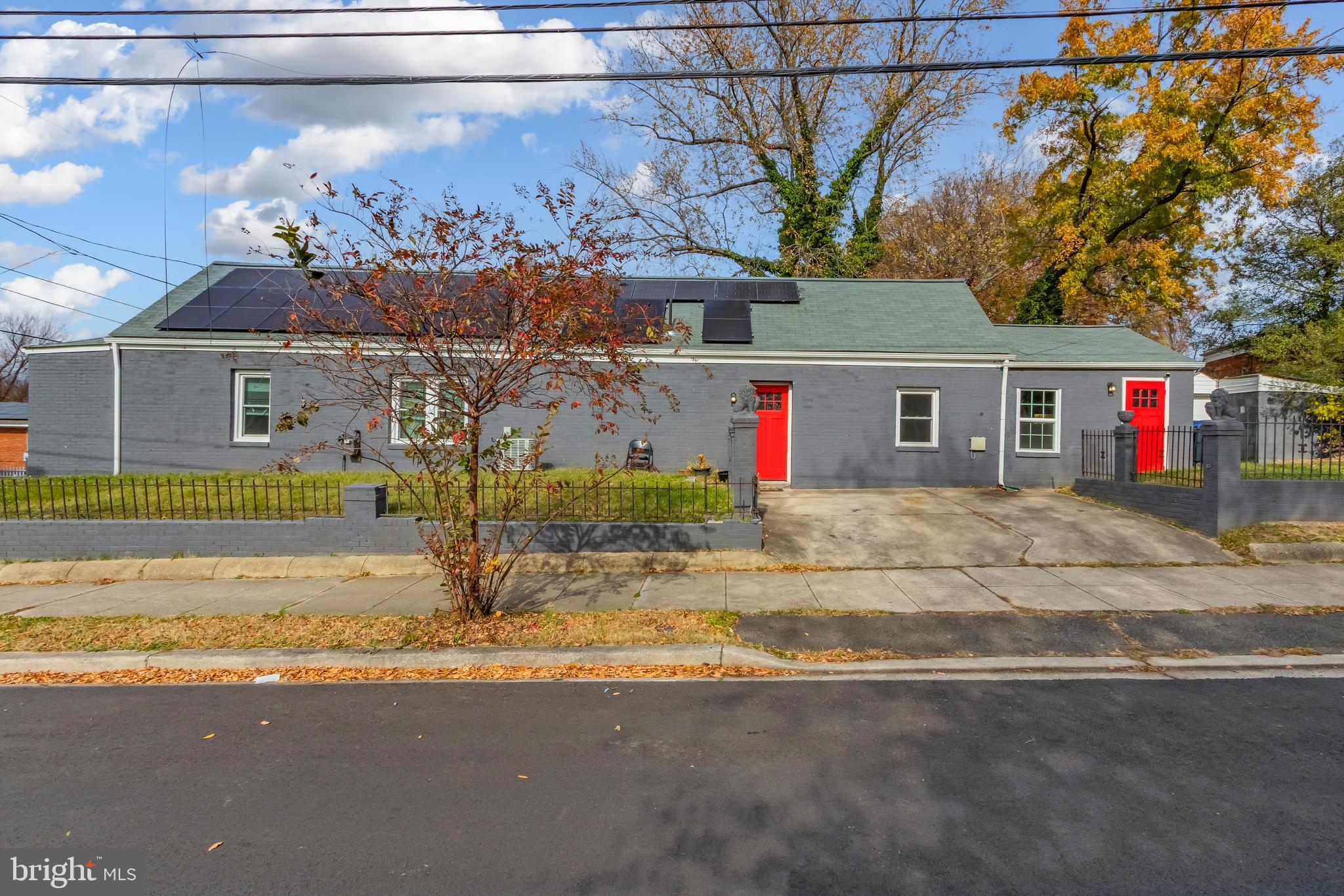 1101 51st Place Northeast Washington, DC 20019 - Photo 2 of 25 a view of a house with a tree and wooden fence