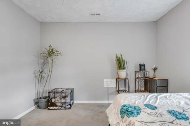 a bed room with a bed and a couch