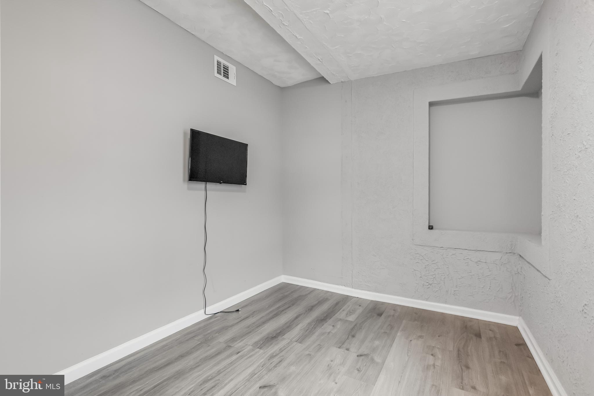 1101 51st Place Northeast Washington, DC 20019 - Photo 23 of 25 wooden floor in an empty room