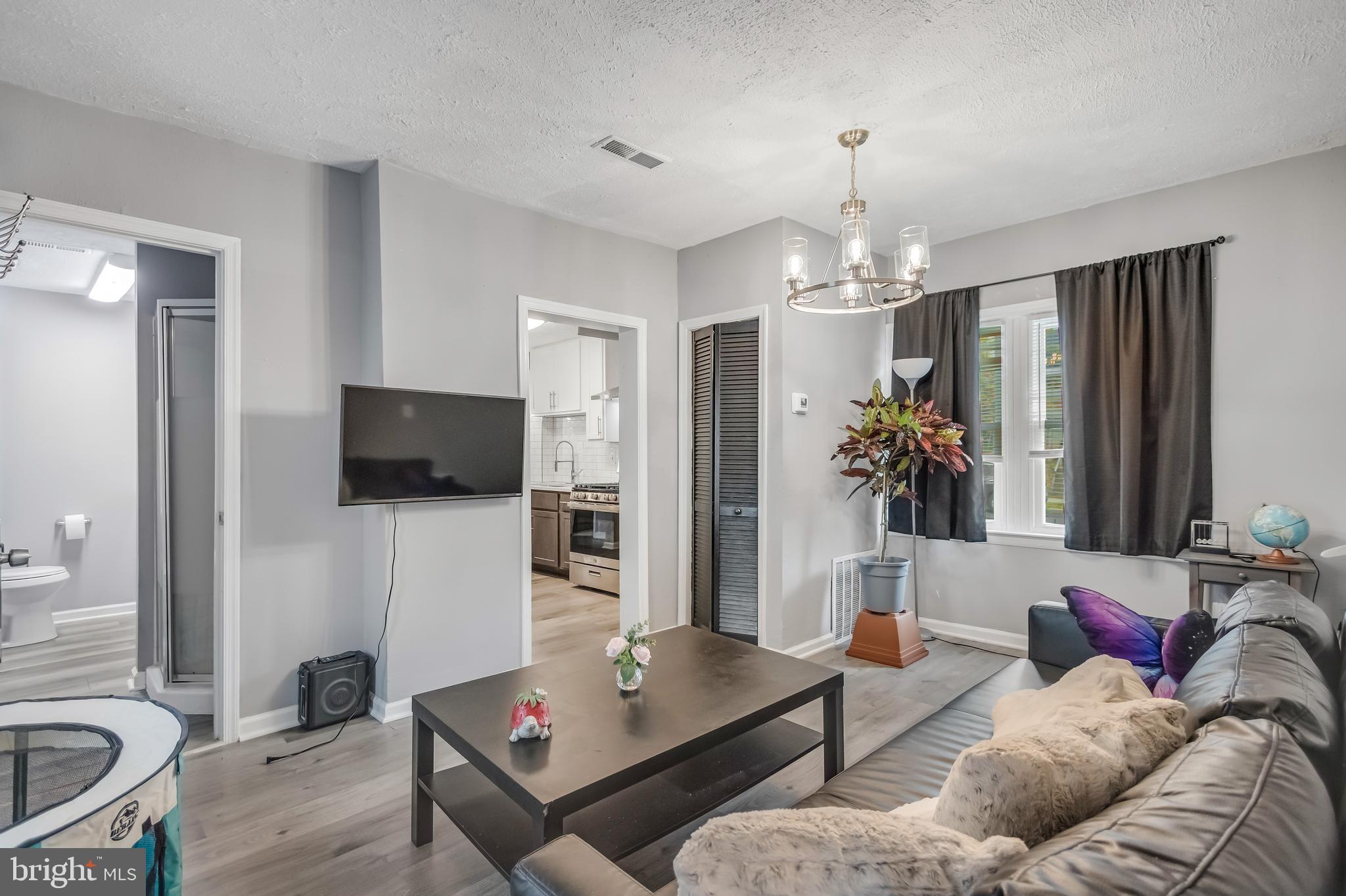 1101 51st Place Northeast Washington, DC 20019 - Photo 9 of 25 a living room with furniture and a flat screen tv