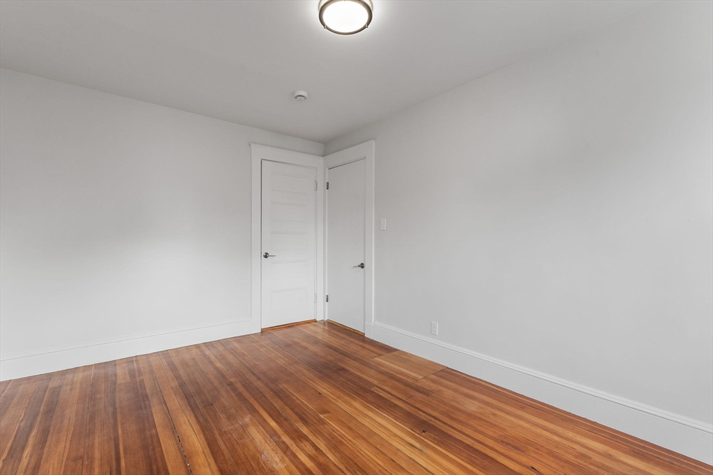 16 Clarkwood Street, Unit 2 Boston, MA 02126 - Photo 16 of 34 a view of a room with wooden floor