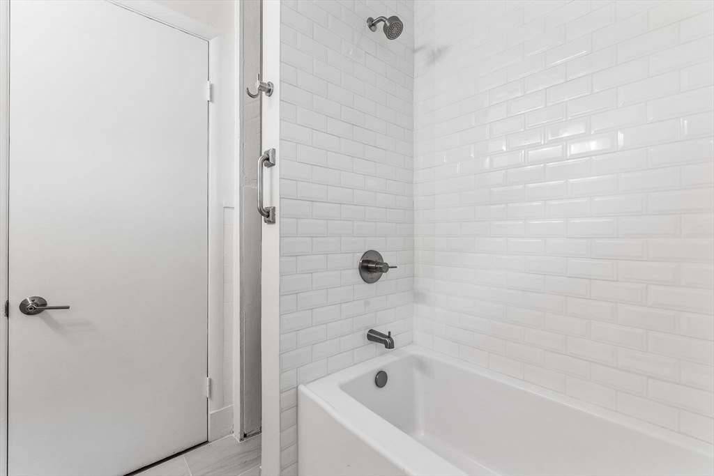 16 Clarkwood Street, Unit 2 Boston, MA 02126 - Photo 20 of 34 a bathroom with a bathtub