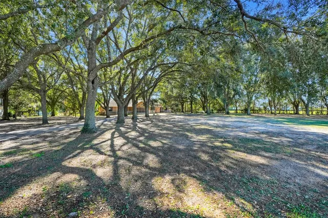 an aerial view of ocean residential houses with outdoor space and swimming pool