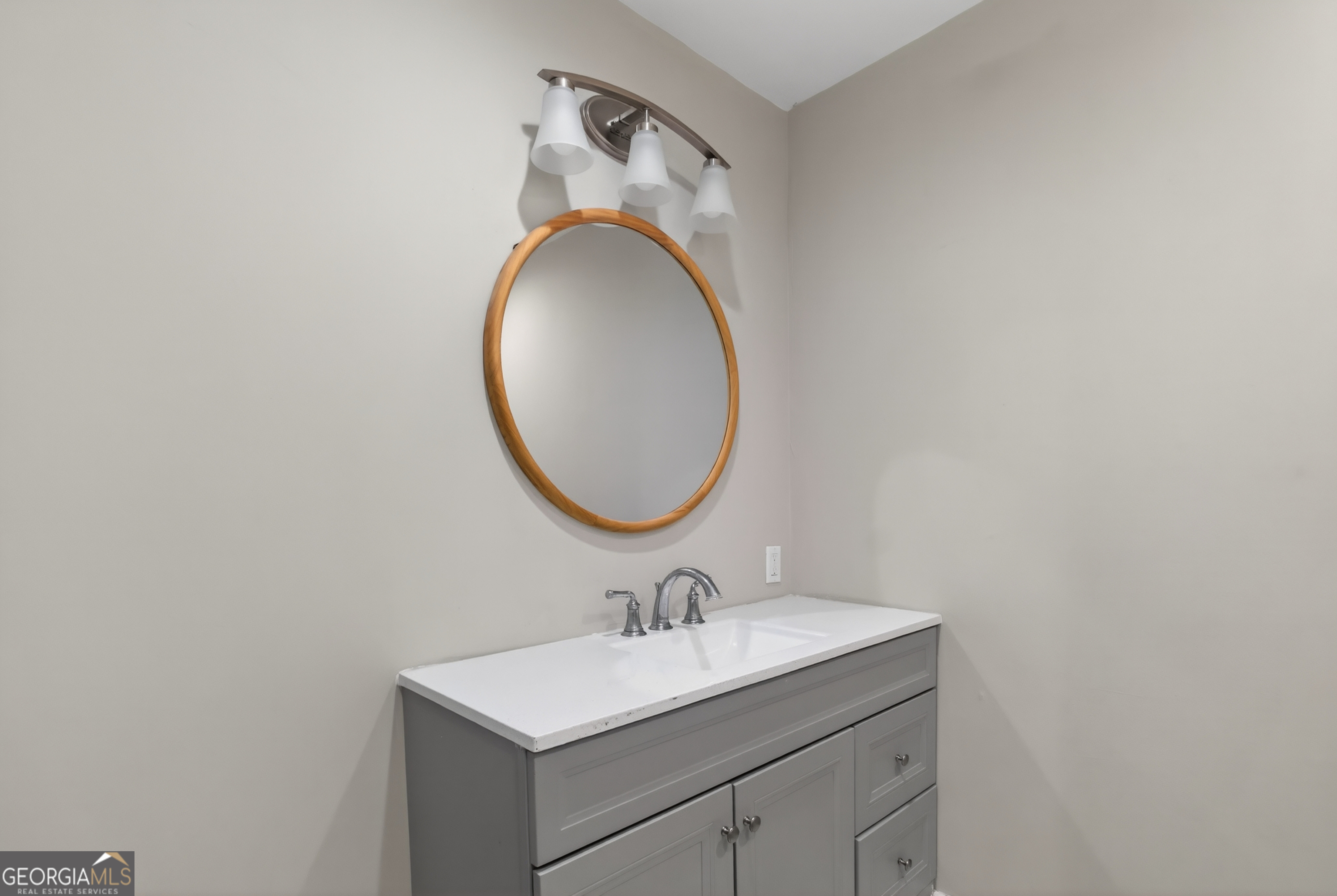 49 Milner Street Temple, GA 30179 - Photo 18 of 32 a bathroom with a sink and a mirror