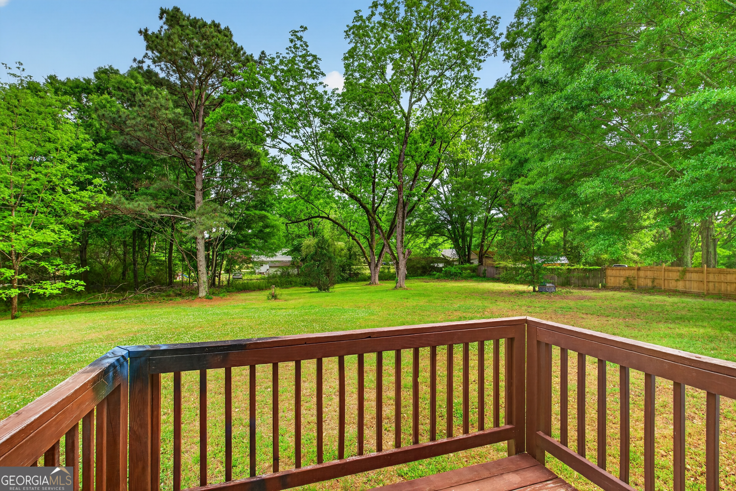 49 Milner Street Temple, GA 30179 - Photo 22 of 32 a view of deck and a yard with large trees