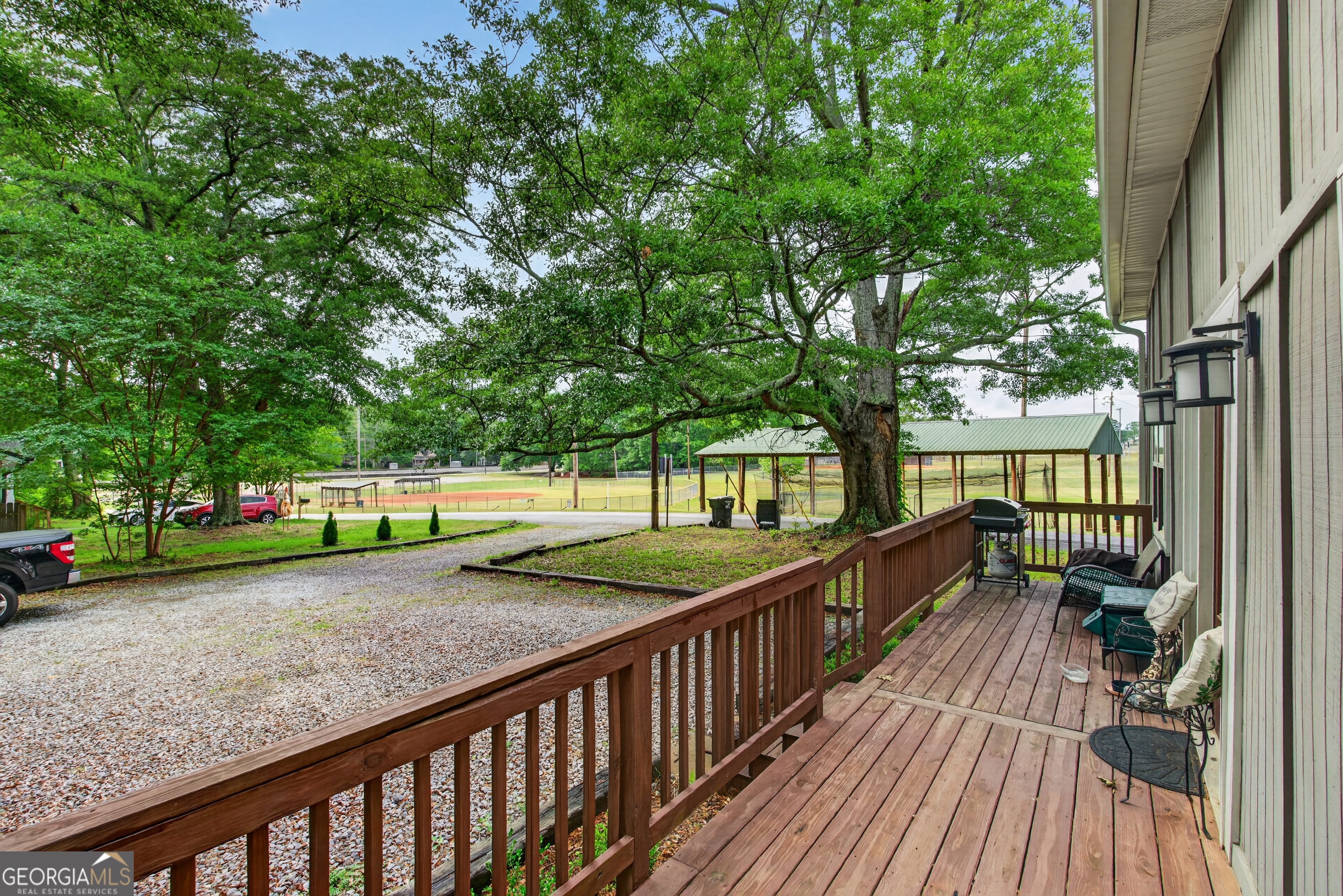49 Milner Street Temple, GA 30179 - Photo 31 of 32 a view of a porch with wooden floor and fence