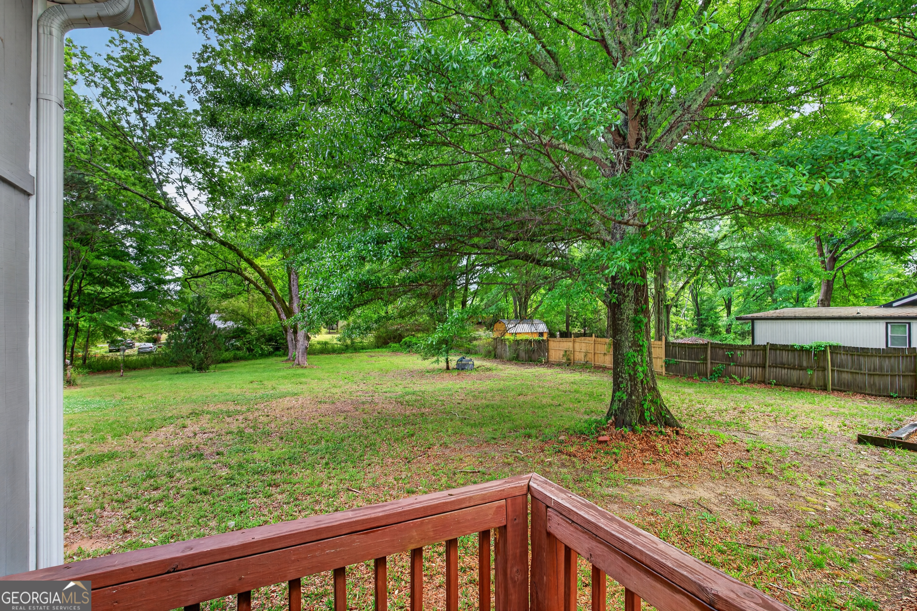 49 Milner Street Temple, GA 30179 - Photo 32 of 32 a view of a backyard with trees