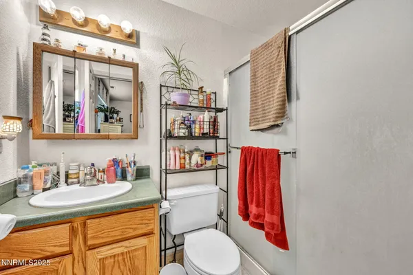 a bathroom with a toilet and a sink