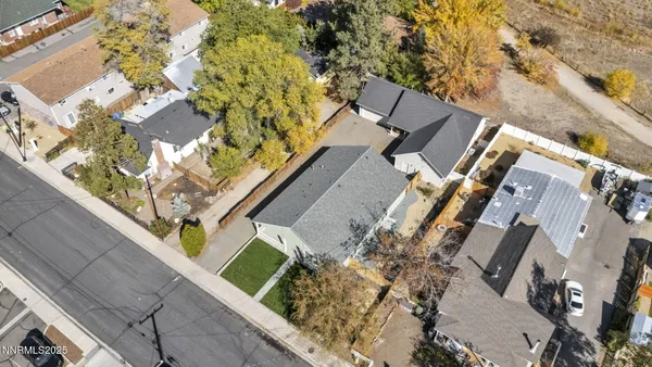 a view of a house with a yard and lake view