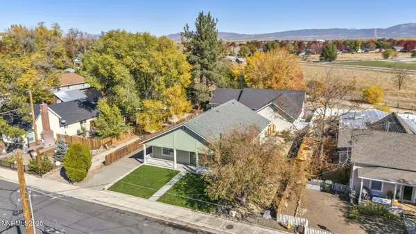 an aerial view of a residential apartment building with a yard