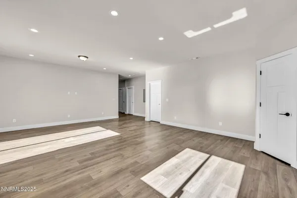 an empty room with wooden floor