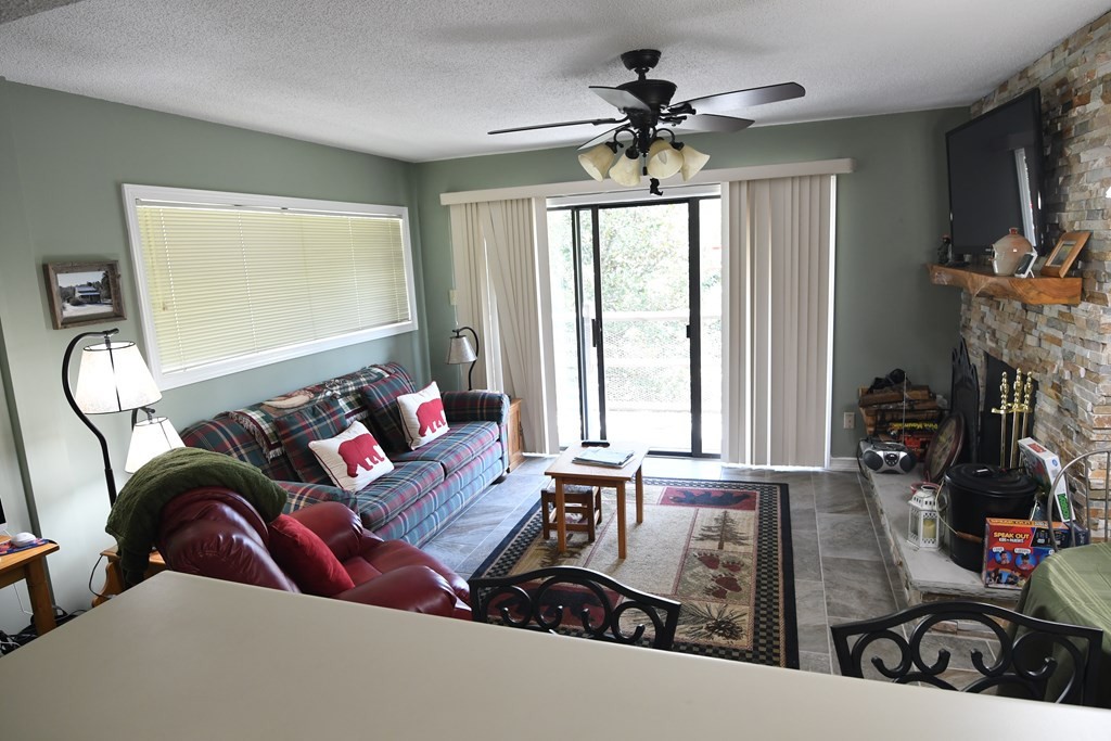 1081821 Cove Road Sevierville, TN 37876 - Photo 5 of 14 a living room with furniture and a flat screen tv