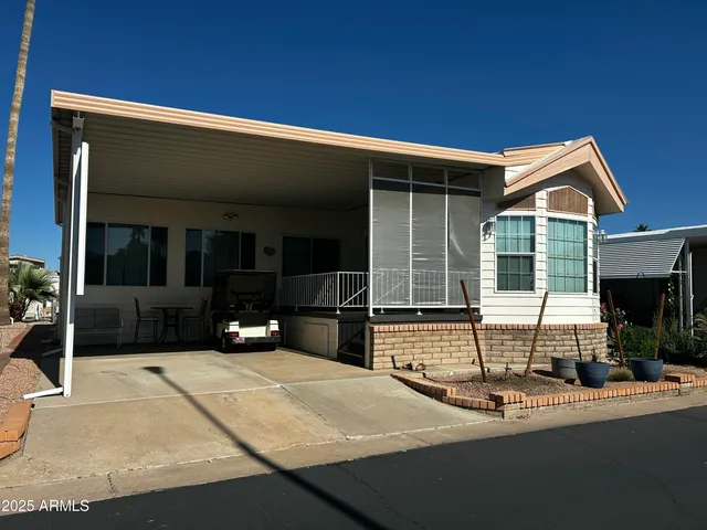 a view of house with outdoor space and porch