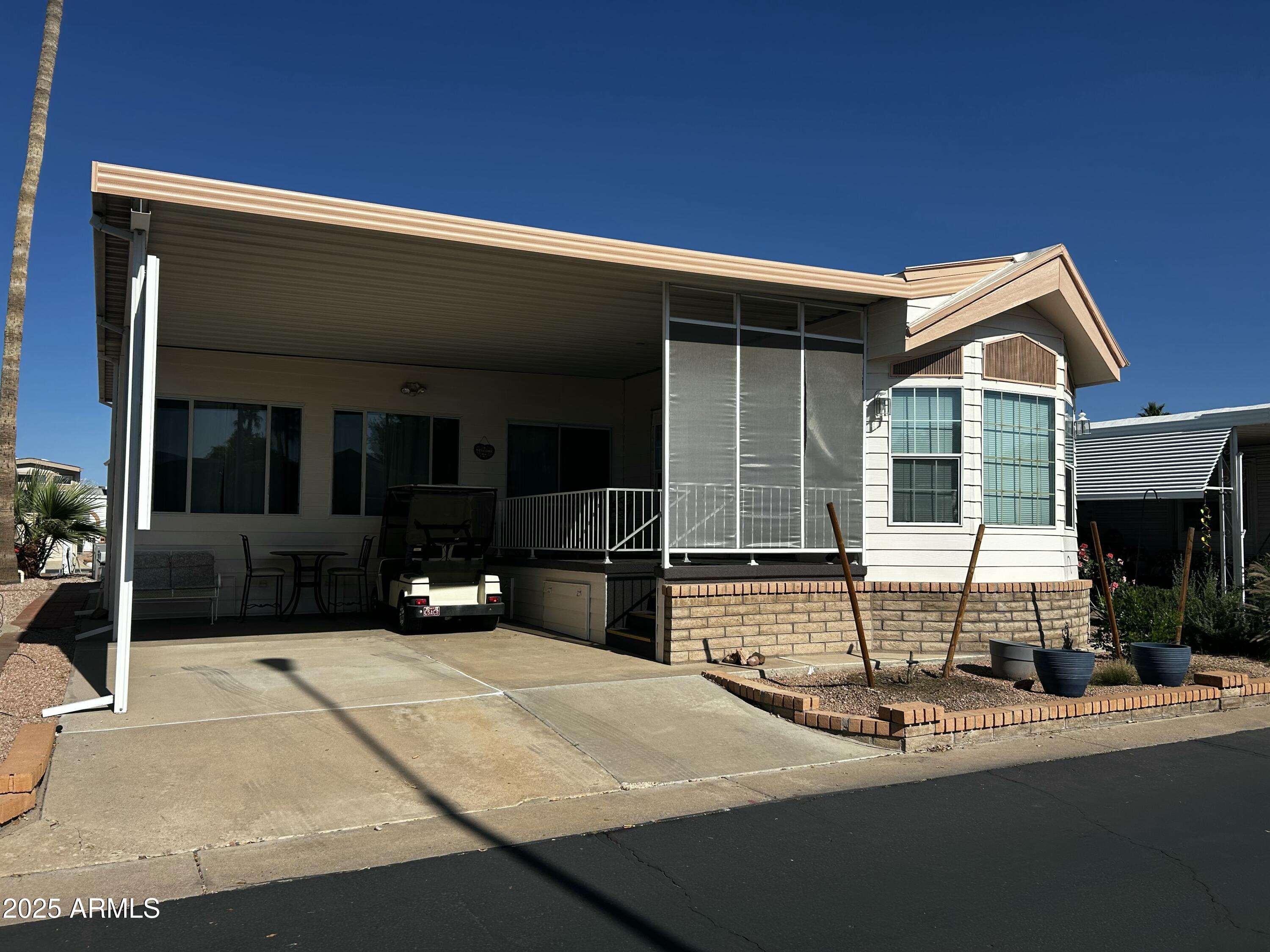 a view of house with outdoor space and porch