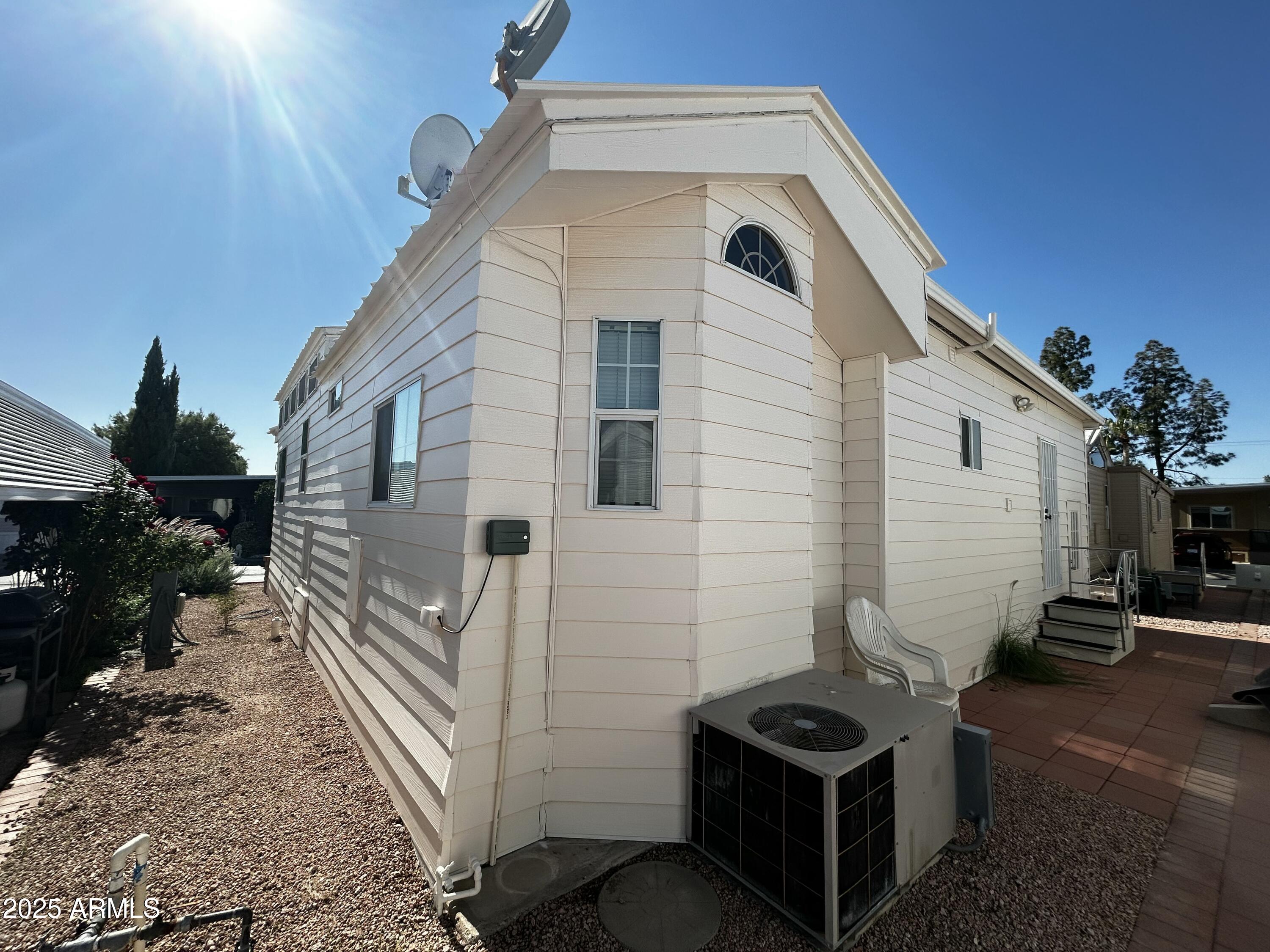 111 South Greenfield Road, Unit 596 Mesa, AZ 85206 - Photo 23 of 26 a view of a back yard of the house